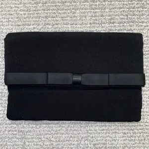 Peau de soie Black Clutch with bow detail